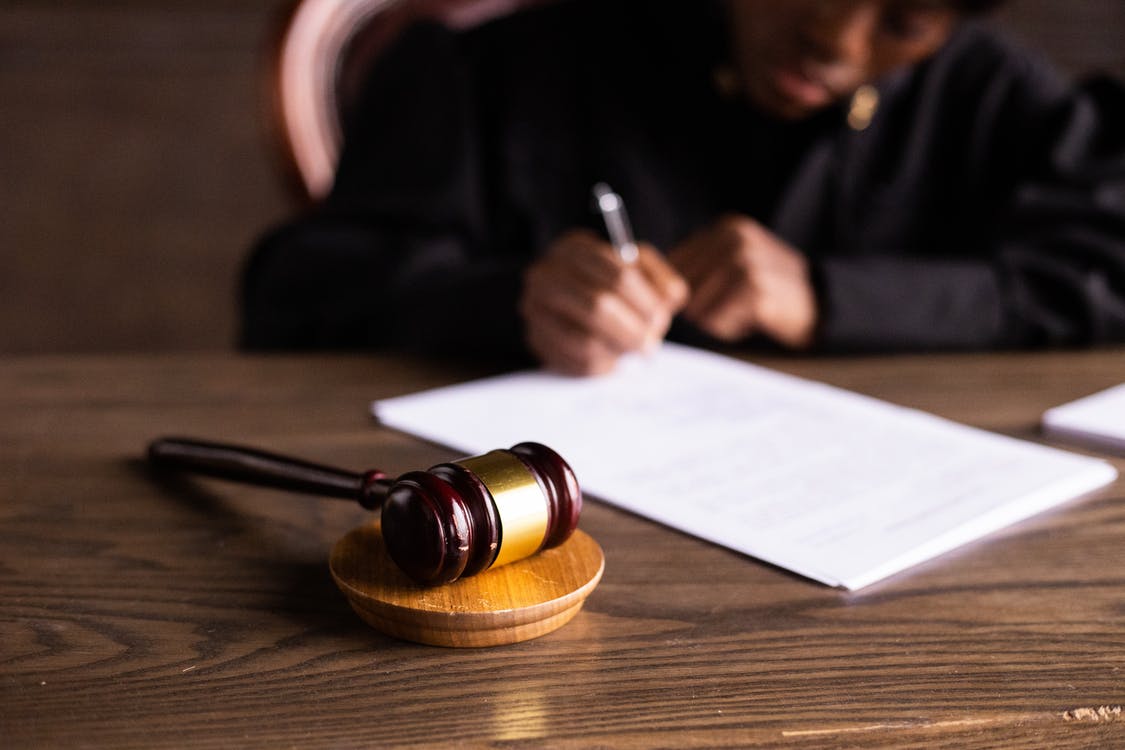 Free Judge Signing on the Papers Stock Photo